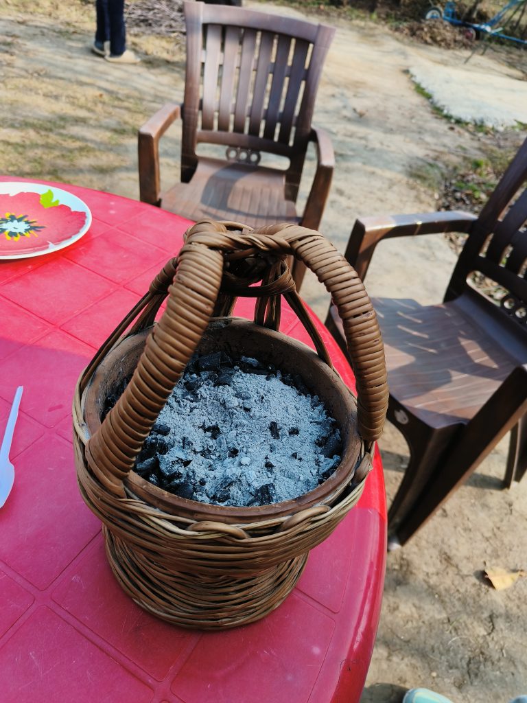 Kangri, a pot filled with hot embers, on a table in Kashmir