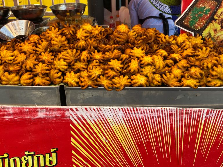 Fried octopuses on display at a street food shop.