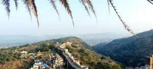 An aerial view of Kumbhalgarh in the mountains. It’s a fort that is also known as the Great Wall of India
