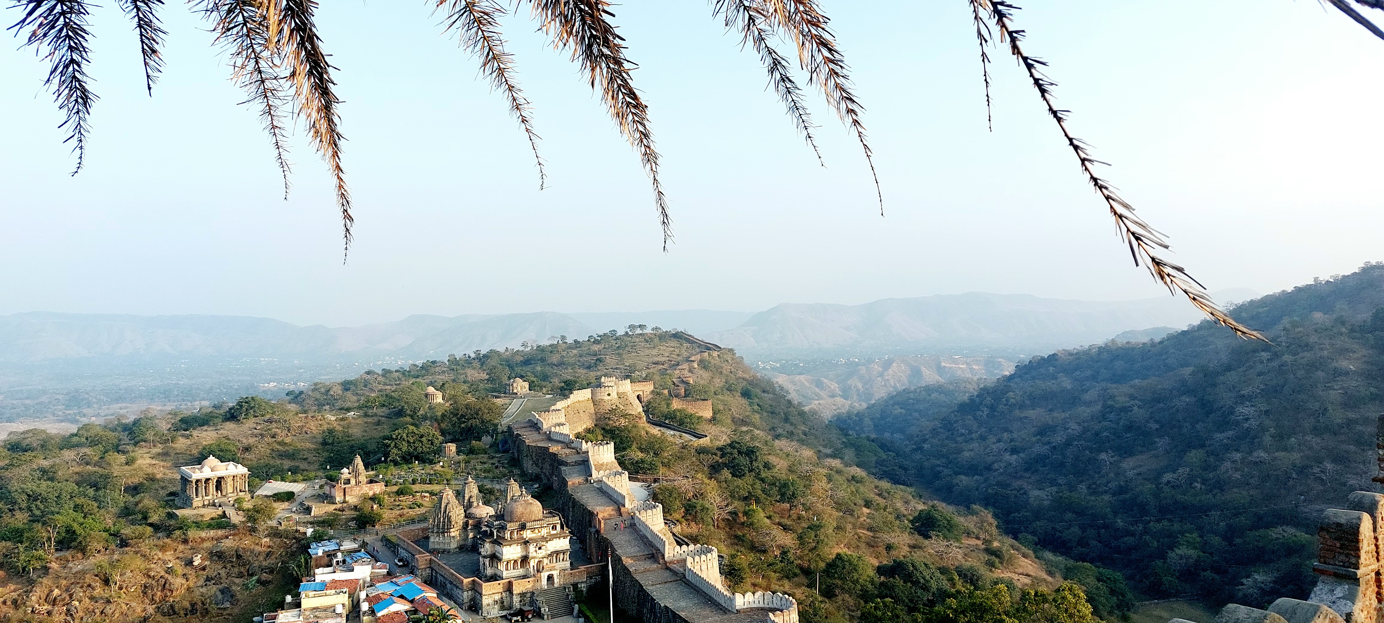 An aerial view of Kumbhalgarh in the mountains. It's a fort that is also known as the Great Wall of India