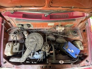 View larger photo: A car engine covered with dust.