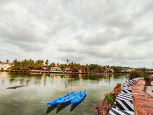 Scenic view of three boats on the Mahe River in India.