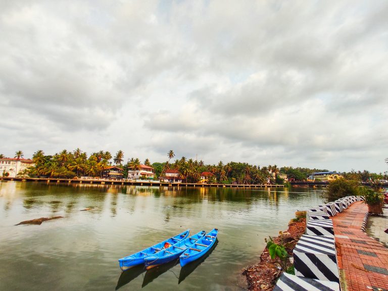 Scenic view of three boats on the Mahe River in India.