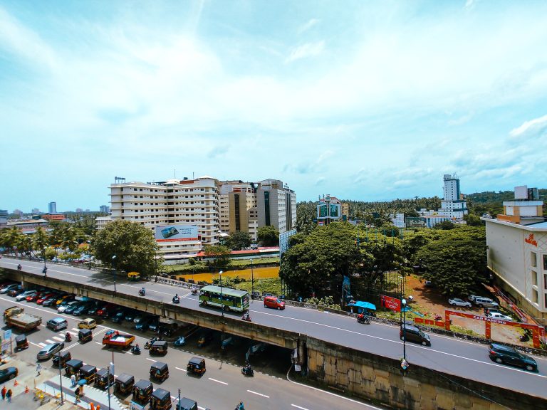 An aerial view of the roads, cars, and buildings of Kozhikode city