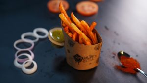 The box of fries is a tempting treat, perfectly served with golden-brown, crispy potatoes.
