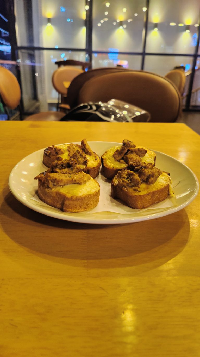 Chicken and cheese toasties on a white plate