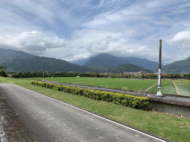 Unused old railway station with green paddy field, Cloudy sky, mountains surrounded located in Dongli, Hualien, Taiwan.