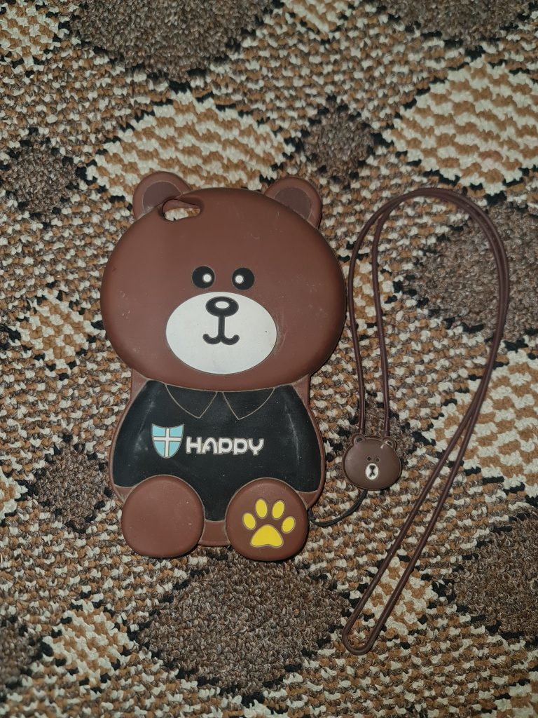 Mobile back cover in a teddy bear design with a brown hue made from silicon material.