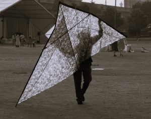 A man bringing his kite during kite festival.