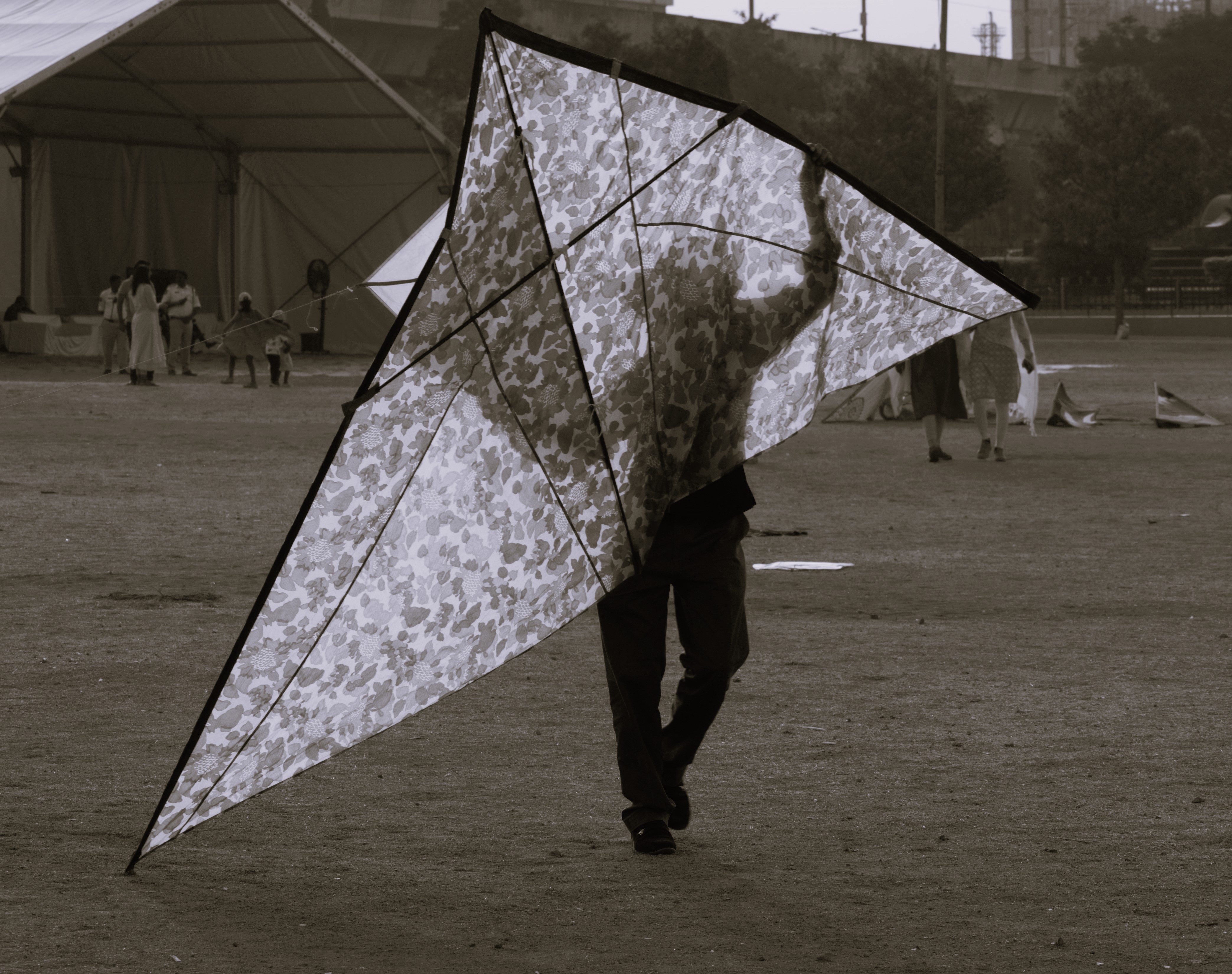 A man bringing his kite during kite festival.