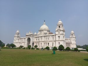 Back view of Victoria Memorial, a large white building with domed turrets, Kolkata, West Bengal, India.