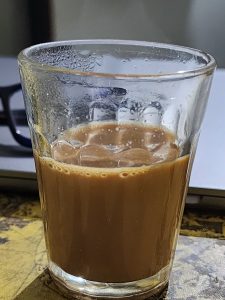Cutting chai, a Glass of milk tea.

