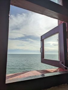 A window view of the sea and the sky.