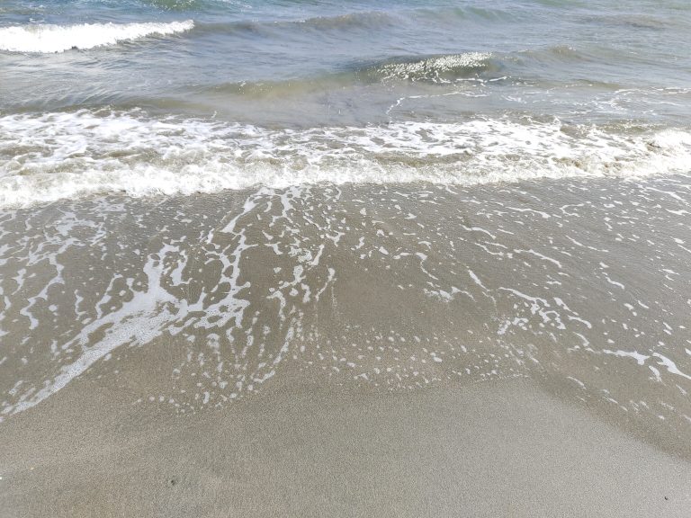 Waves on the shore at the beach.