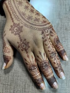 Hand with beautiful henna symbolizing Indian culture 