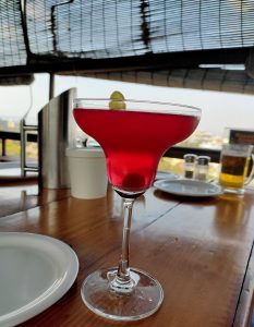 A tantalizing view of a cranberry cocktail, served in an elegant glass, capturing the vibrant hues and tempting allure of this delightful beverage.