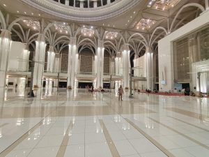 View larger photo: A grand mosque interior with stunning domed ceiling.