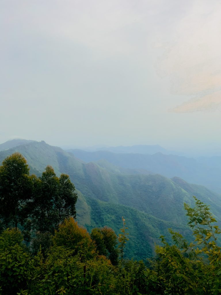 Looking down into a valley between high hills