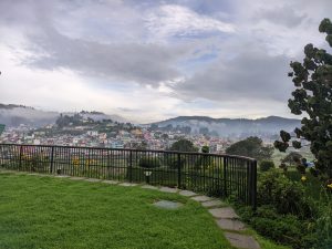 Distant landscape view of the Ooty city covered with fog
