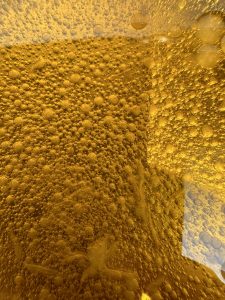 View larger photo: A close shot of bubbles in a mixture of oil and lemon