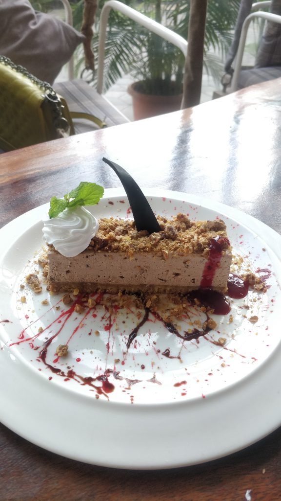 A delectable Hazelnut Cheesecake on a pristine white plate, ready to be savored.