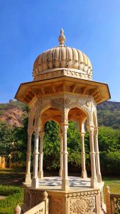 A dark yellow colored stone dome in Gaitor Ki Chhatriyan. Photo taken from Jaipur, Rajasthan.
