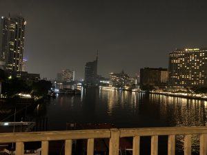 City lights reflect on the river