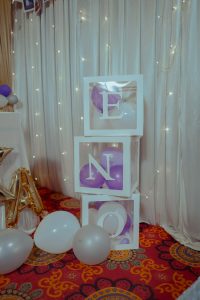 Birthday decoration boxes with balloons inside.