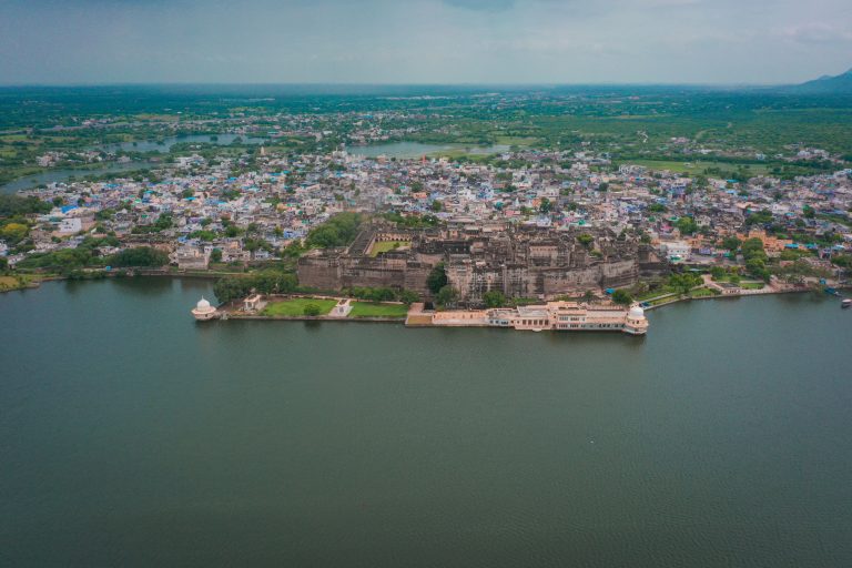 A Grand Palace on the shore of a large body of water