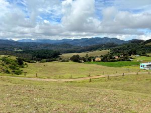 houses and farmland in a valley surrounded by hills