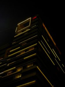 A highrise building at night
