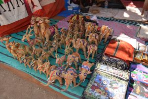 Handmade toys and bags made of thread are available in a shop in an Indian village.