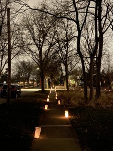 White paper bag luminaries lining sidewalks at dusk (Downers Grove, Illinois)
