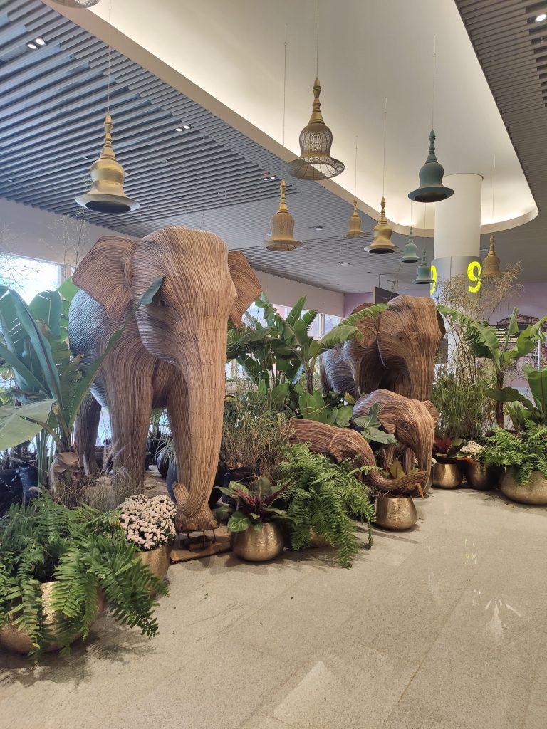 Wooden Elephant family in an indoor garden.