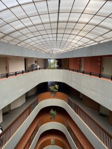 The multi-story building boasts corridors in a unique, novel shape.