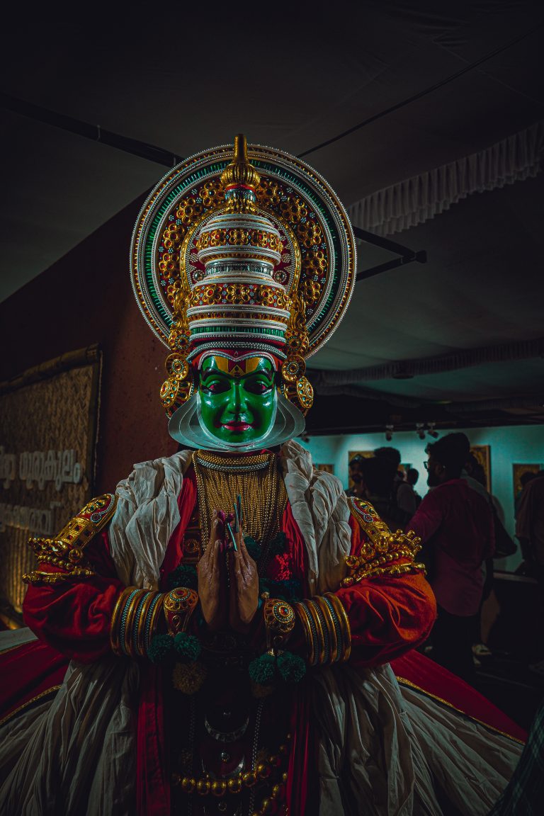 Kathakali performance unfolds in vivid colors, showcasing the artistry of traditional Indian dance with elaborate costumes and expressive gestures, capturing the essence of cultural storytelling.