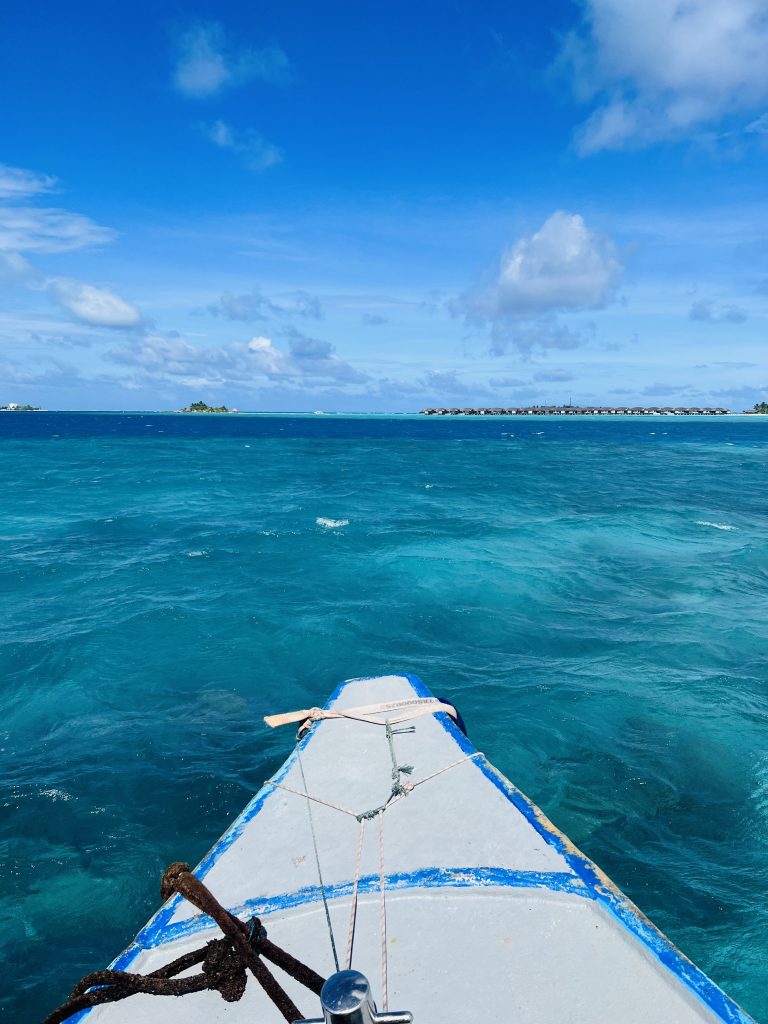 Bow of a small boat on a blue sea