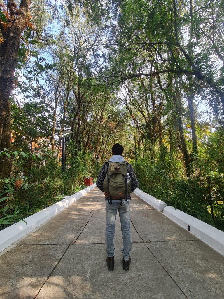 A man ready to embark on a journey, equipped with a backpack.