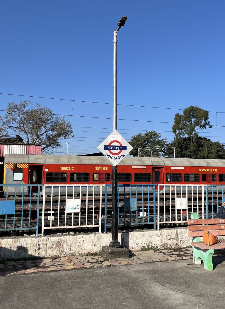 Dehradun Railway Station: Early morning arrival, a bustling scene of travelers, the start of a new day.