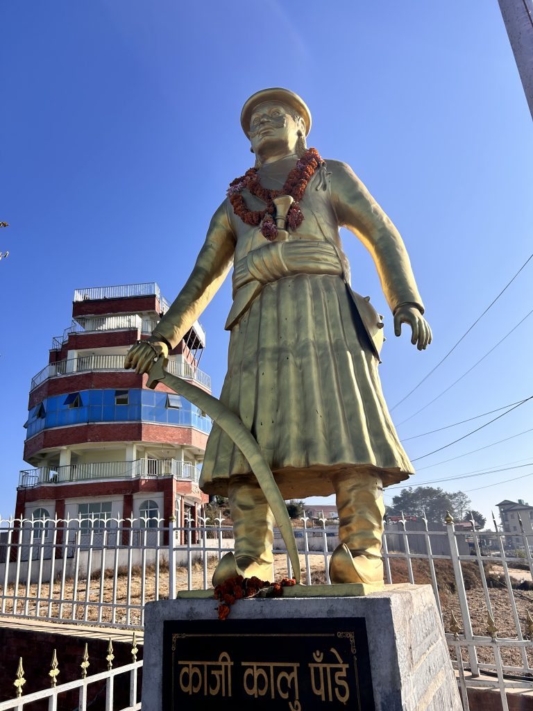 A statute of Kalu Pandey and a view tower in the background.