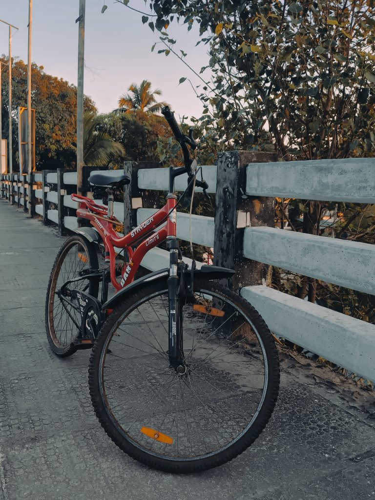 A bicycle on walkway of the bridge.