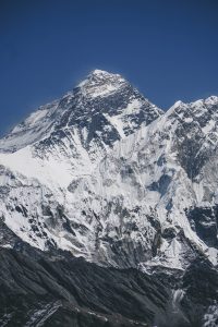 At the top of the world, Mount Everest is covered with a layer of snow.