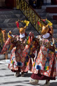 People wearing mask dance during Ladakh festival.