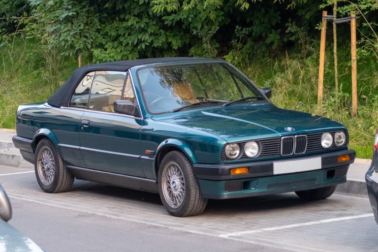 Convertible laguna green car with tan leather seats.