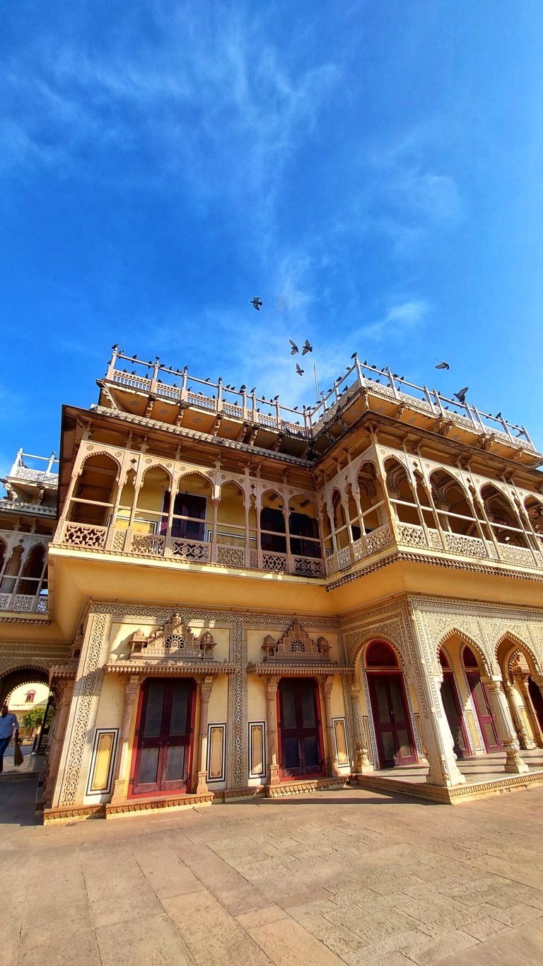 The City Palace with a lot of columbidae birds. The City Palace in Jaipur is a royal residence and former administrative headquarters of the rulers of the Jaipur State in Jaipur, Rajasthan.