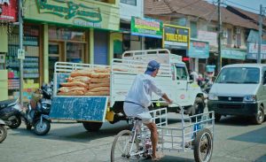 A man with cycle, photo taken from valiyangadi, kozhikode.