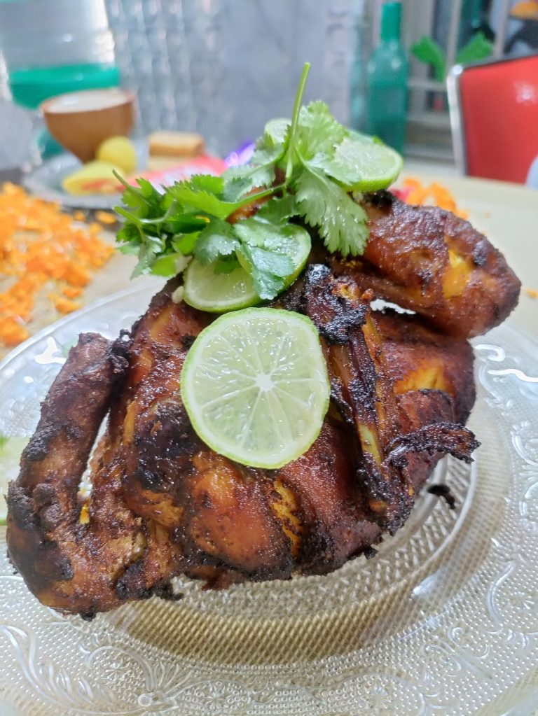 Tandoori chicken is a dish made from chicken marinated in yogurt and spices and roasted in a tandoor, a cylindrical clay oven.