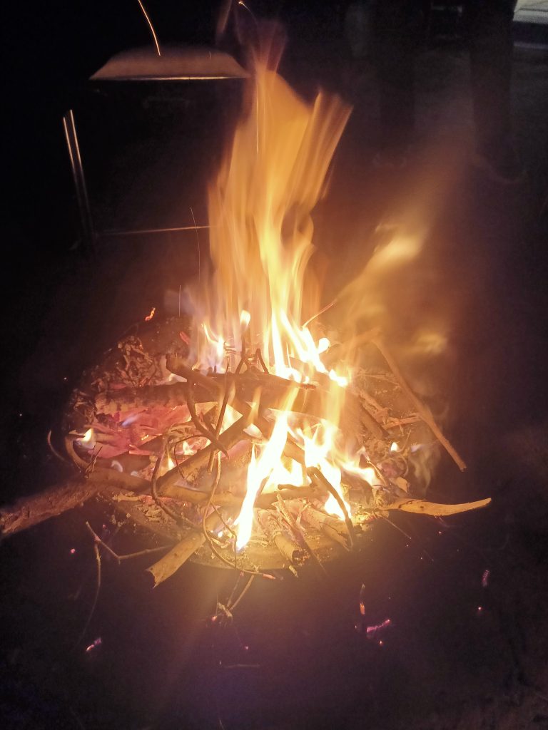 Bonefire. Wood and twigs burning in the dark.