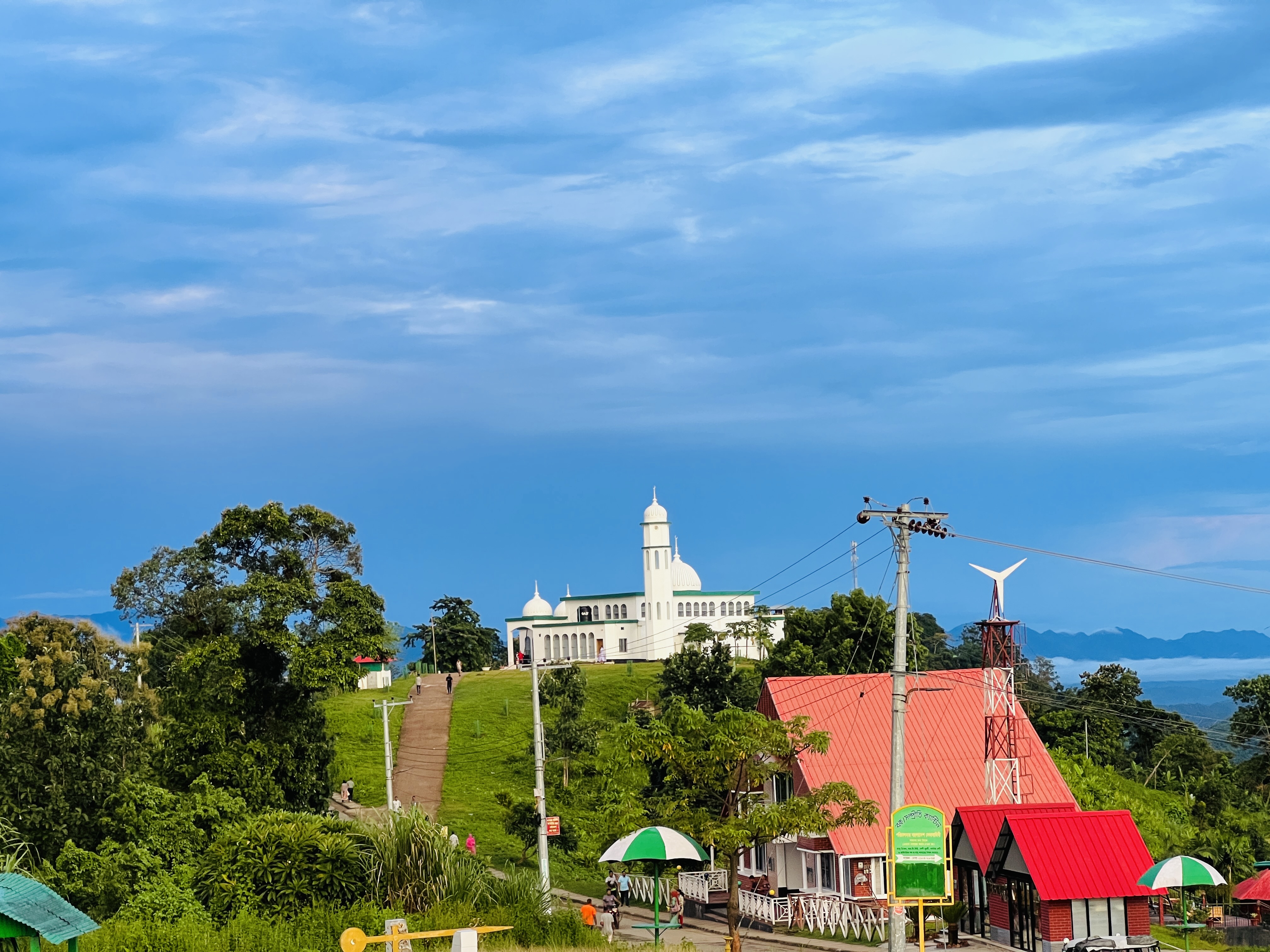 A beautiful mosque on a hill on a sunny day.