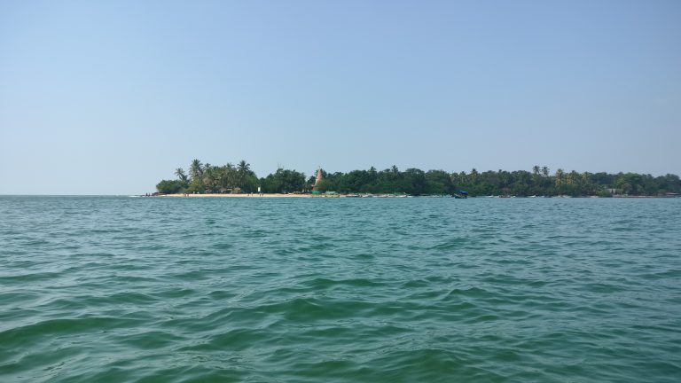 A photo capturing the serene beauty of the Last end of Devbag beach, where the sea water meets.